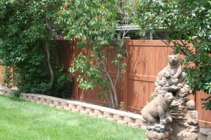 wood grain Vinyl Fence with bear statue