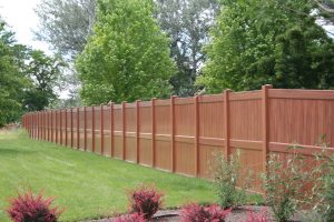 Mocha Walnut privacy fence with beautiful flowers