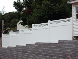 Privacy fencing on top of rock wall