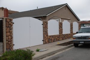 rock fence with vinyl fence insert